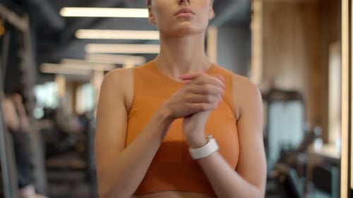 Young Sporty Woman Preparing to Workout in Sport Club. Closeup Focused Fitness