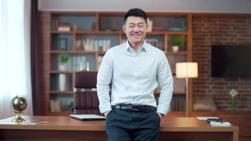 close-up portrait happy asian guy employee entrepreneur office worker in a shirt indoors. modern