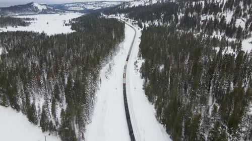 4K Drone Shot of Train in Mountains