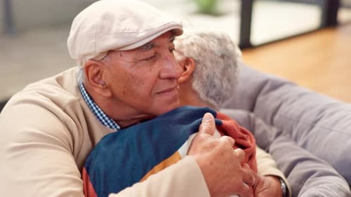 Affectionate Senior Couple Embracing Tenderly at Home