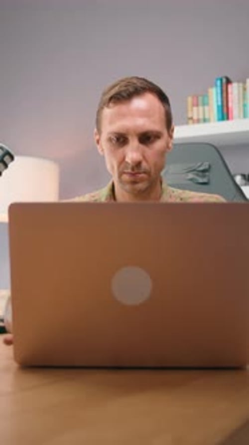 Man with Laptop in Modern Home Office Remote Work Concentration Freelance Productivity