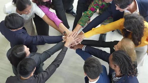 Business team stacking hands