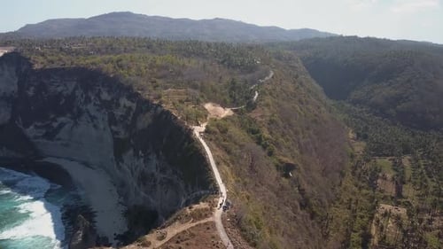 Dirty polluted beach with lots of garbage on Nusa Penida, Indonesia