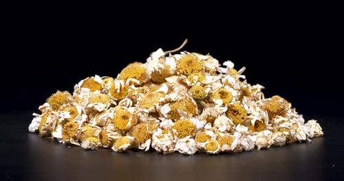Pile of Dried Chamomile Flowers Close Up