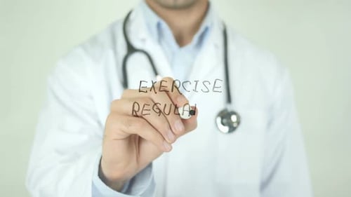 Excercise Regularly, Doctor Writing on Transparent Screen