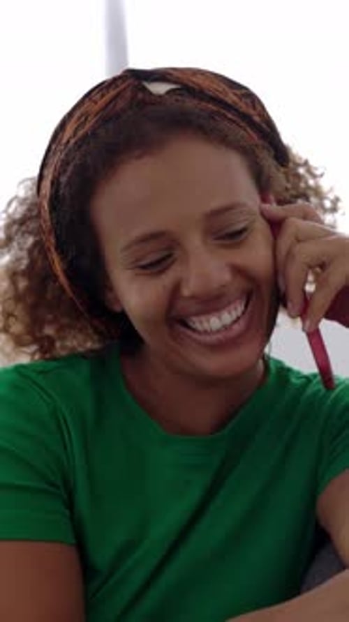 Woman Talking on Phone, Smiling Indoors
