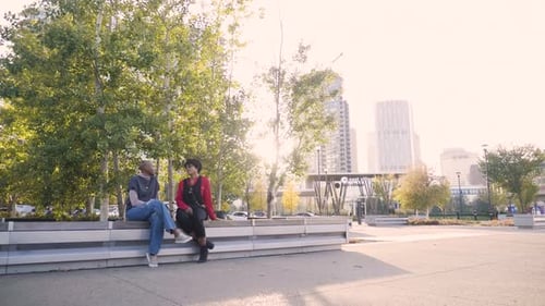 Women Friends Talking in Sunny Urban Park in City 3034 Years