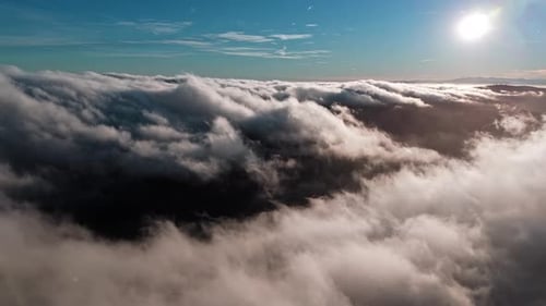 Majestic Aerial View of Clouds at Sunset with Serene Atmosphere