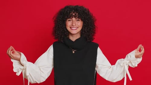Smiling Woman Meditating Against Red Background