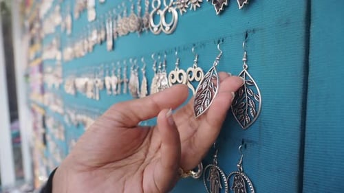 Exploring Unique Silver Earrings at a Vibrant Market