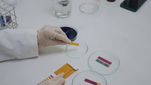 Close Up Experiment with Litmus Paper in Laboratory