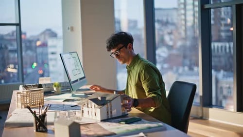 Architect Checking House Layout Working on Architectural Project at Office
