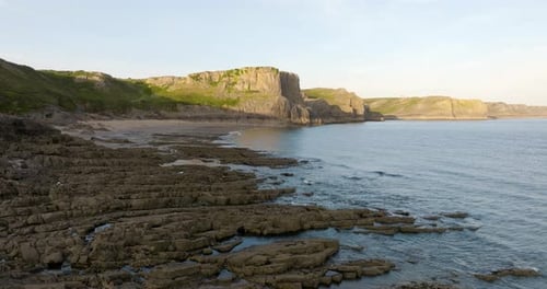 Quiet Sandy Beach And Rock Formations Aerial View
