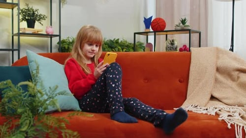 Girl Relaxing at Home with Mobile Phone