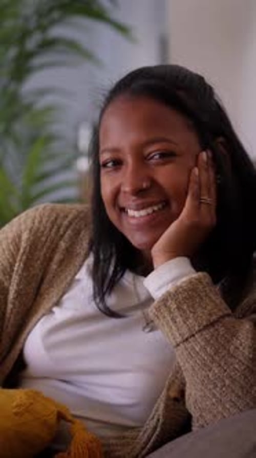 Smiling Young Woman in a Knit Sweater