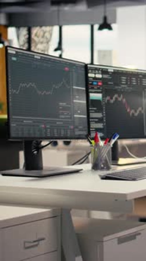 Vertical Video Trading Software in Proprietary Firm Office with Candlestick Graphs on PCs