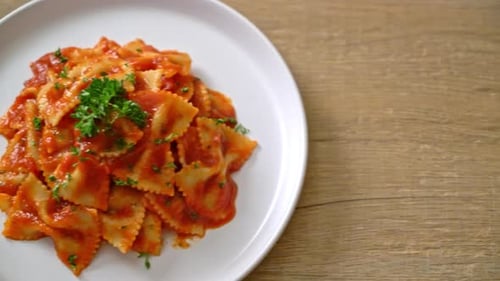 farfalle pasta in tomato sauce with parsley - Italian food style