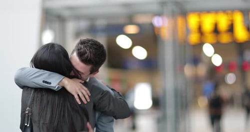 Couple meeting at a station