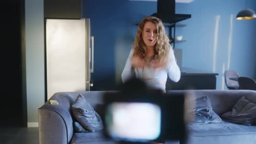Blonde Woman Dances in Front of Camera