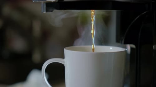 Close Up Shot of Steam From a Hot Drink From White Cup Fresh Cafe in the Kitchen of Home Slow Motion