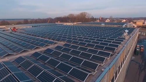 Aerial view of solar panels on factory roof