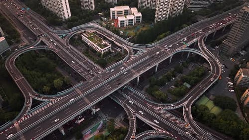 Aerial View of a Busy Highway Interchange with Multiple Lanes and Traffic in an Urban Setting