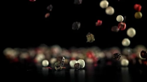 Colorful Peppercorns Falling in Slow Motion