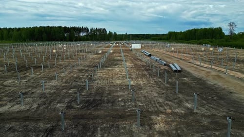 Aerial view of solar panel field installation in progress