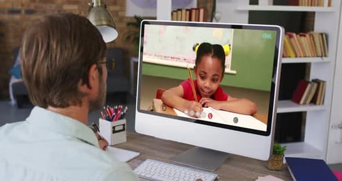 Adult and Child Communicating on Computer Video Call
