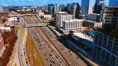 Flight above the highways with busy traffic. Top view on the downtown of Atlanta, Georgia, USA