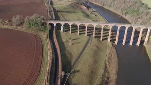 Aerial view of Leaderfoot Viaduct, river, fields, and trees, United Kingdom.
