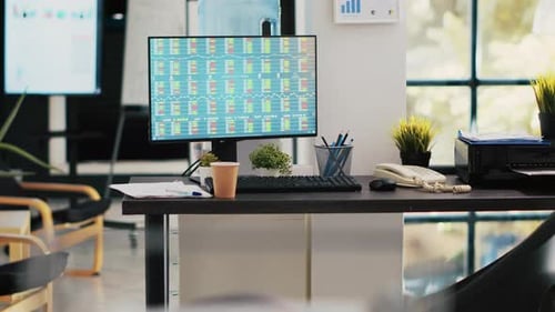 Stock Analytics Figures on PC Screen in Financial Department Workplace