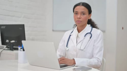 Female Doctor Working at Her Desk