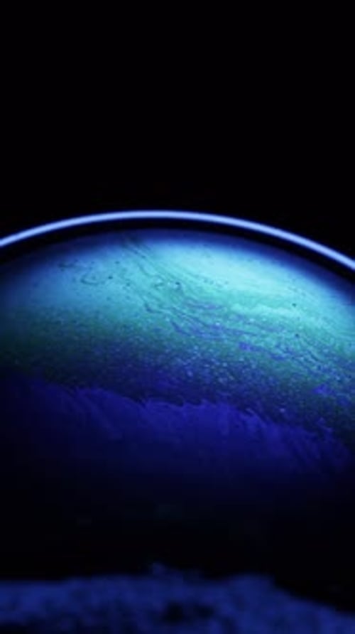 Iridescent Colors Swirl in a Soap Bubble