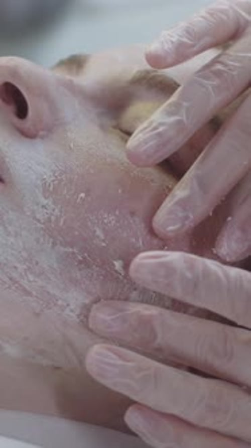 Woman Receiving Facial Treatment at Medical Spa