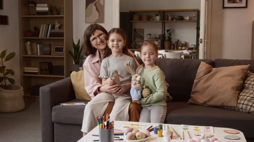 Woman and Two Girls with Easter Decorations on Couch