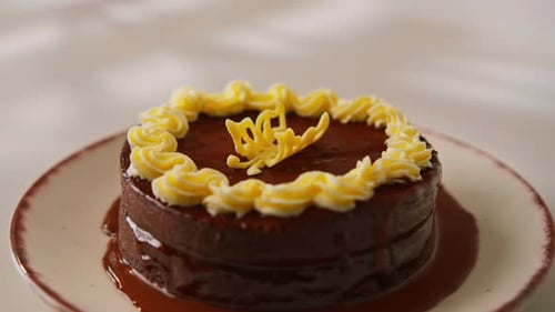 delicious chocolate Sacher or Prague cake on white background dessert decorated with custard