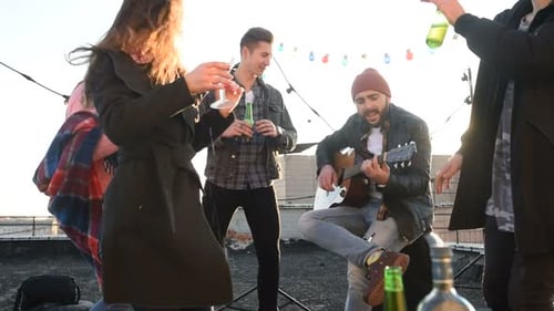 Friends Celebrate with Music on Rooftop Party
