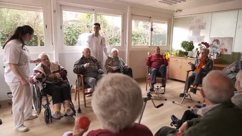 Seniors Exercising Together With Healthcare Assistance