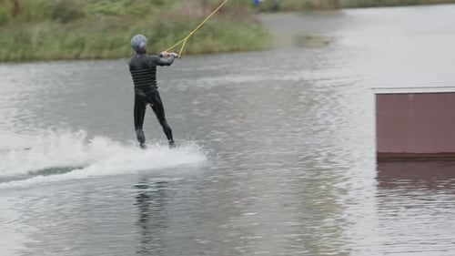 Wakeboarder Surfing across Lake