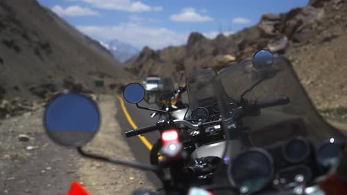 Motorcycles Stand in Front of the Himalayan Mountains