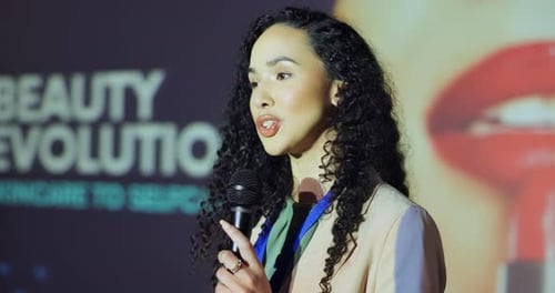 Woman Gives Presentation at Beauty Industry Event