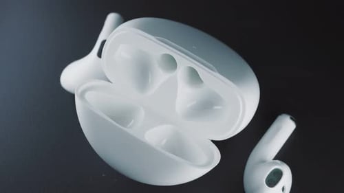 White Wireless Earbuds with Open Charging Case