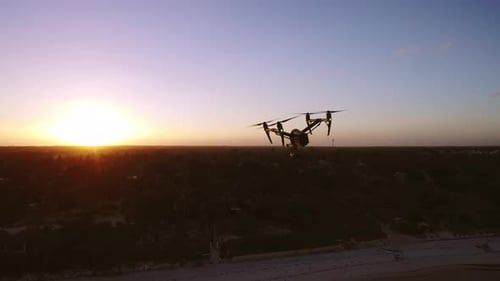 Aerial Drone Quad Copter Footage Flying Over Tropical Area And Towards The Sun.