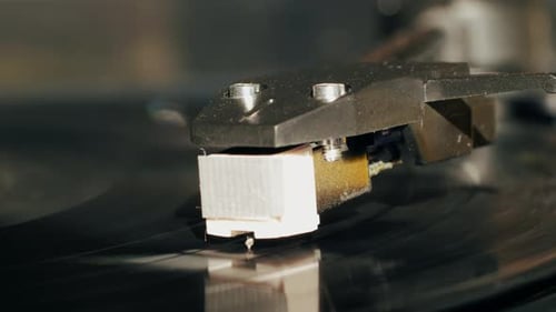 Close Up of Needle on Spinning Vinyl Record