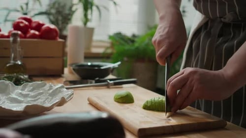 Slicing Fresh Avocado in Kitchen