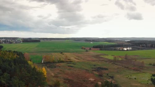 Wide cultivated farmland in Charzykowy, Poland - wide shot