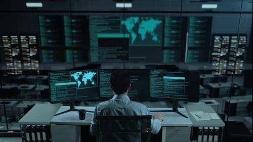 Happy Asian Man Celebrating While Write Code With Multiple Computer Screens In office