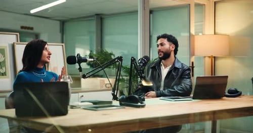 Woman, man and discussion for podcast with microphone, interview or question for studio guest