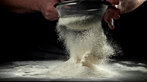 The Cook Sifts the Flour Filmed on a Highspeed Camera at 1000 Fps